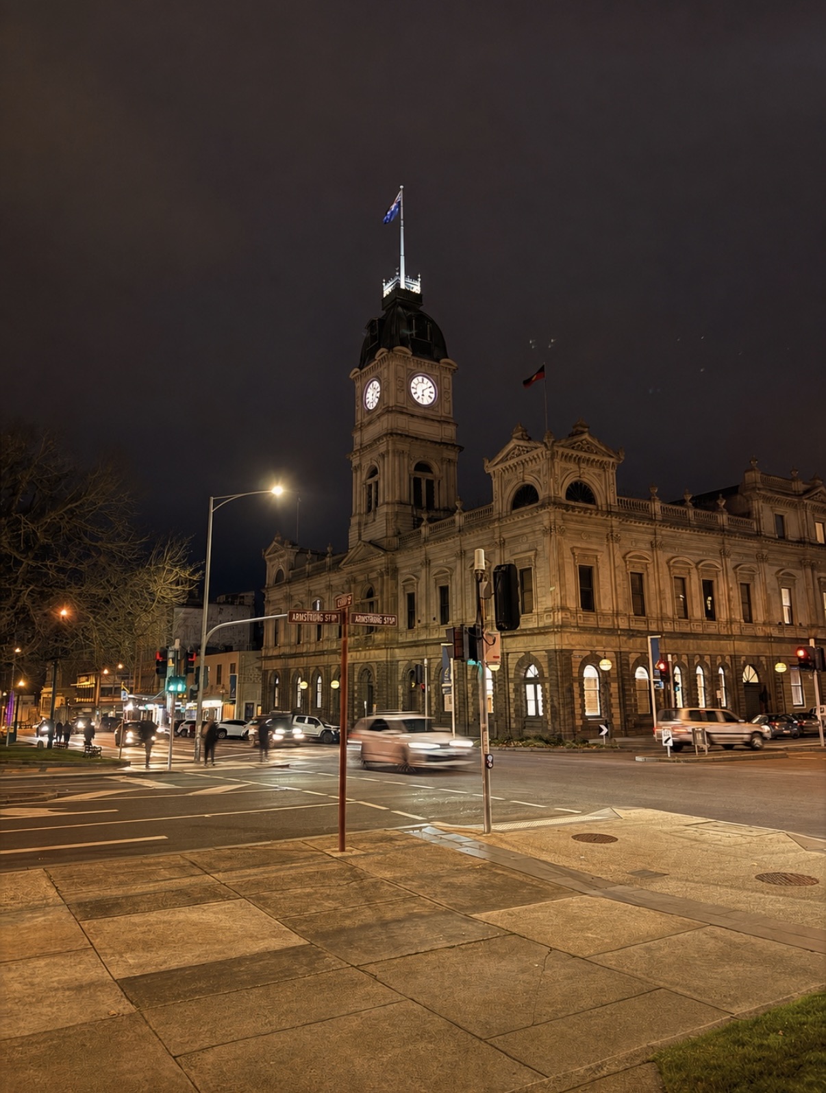 Ballarat Town Hall clock tower lit up at night on Sturt Street